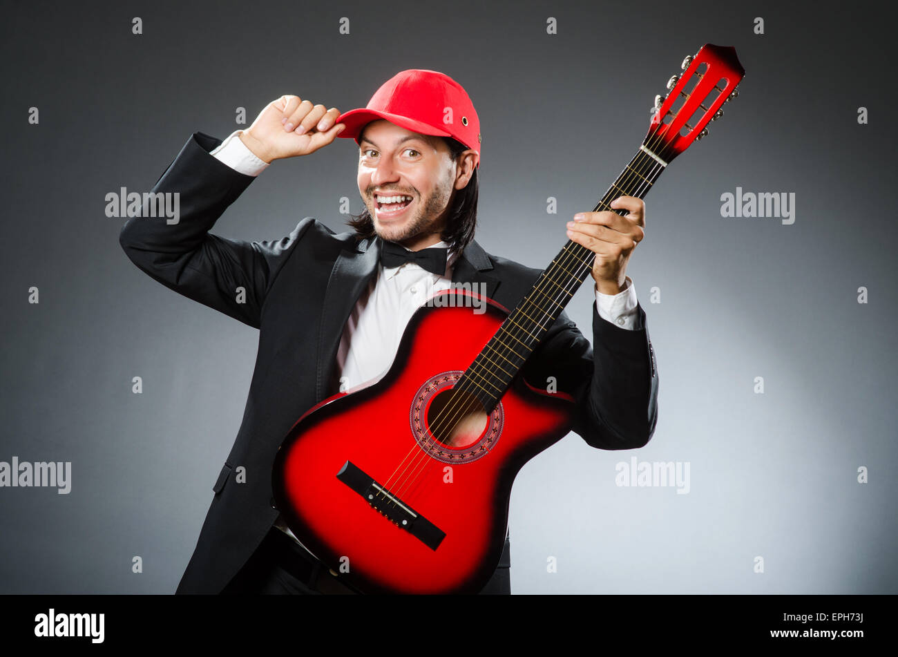 Funny guitar player in studio Stock Photo - Alamy