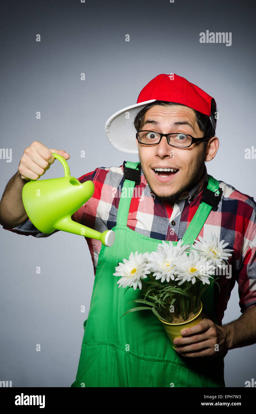 Funny man with watering can Stock Photo Alamy