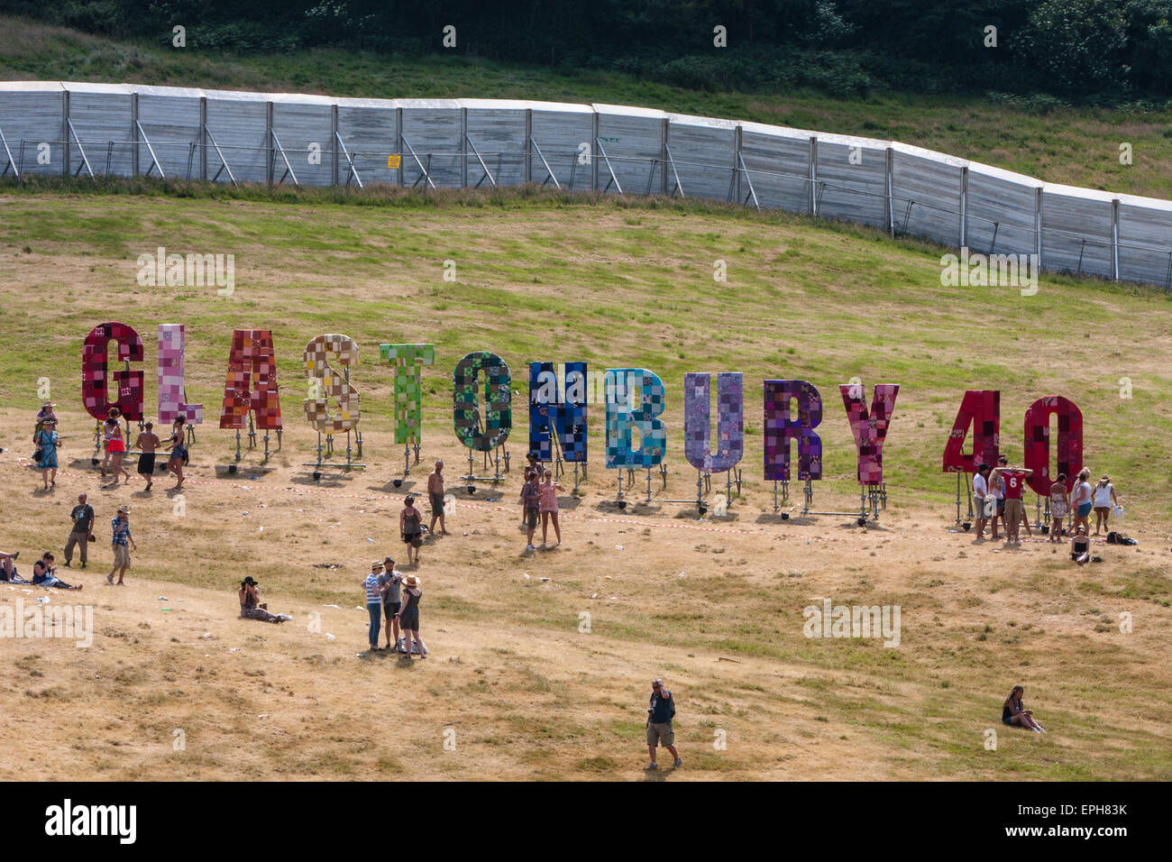 Ring of steel fence and 40th anniversary sign (1970-2010) at Glastonbury Festival/ 'Glasto' held on working farm, Worthy Farm, n Stock Photo