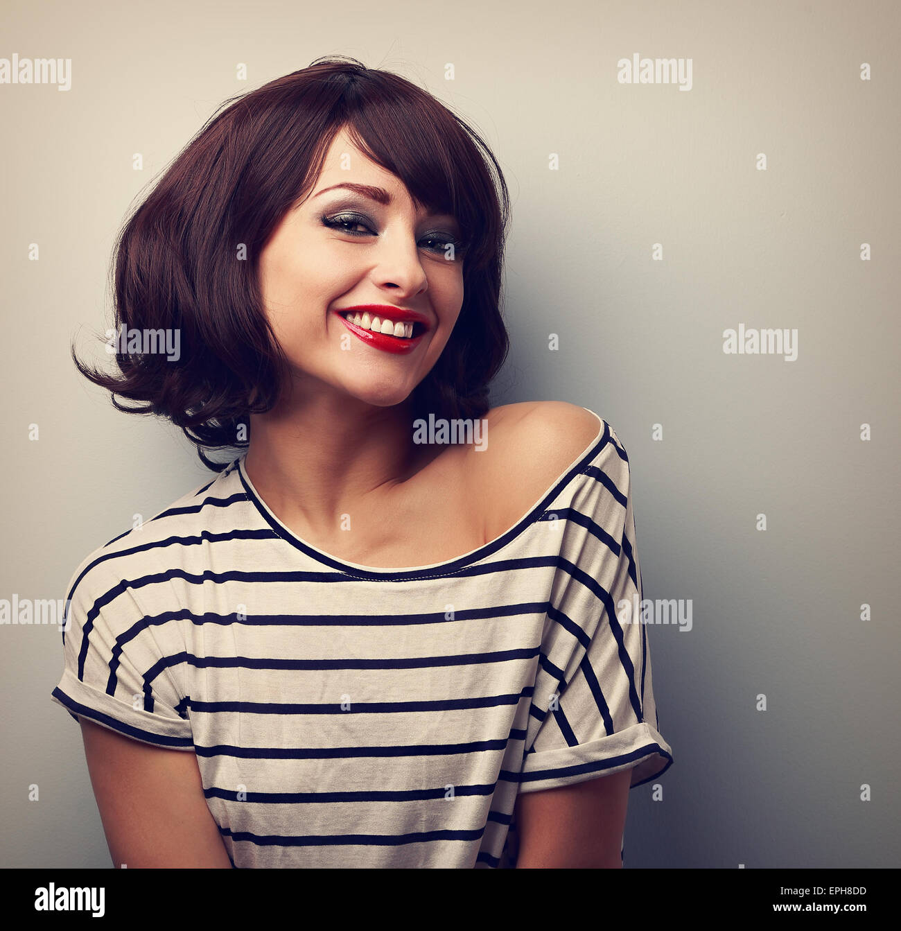 Happy Laughing Young Woman With Short Hair In Fashion Blouse