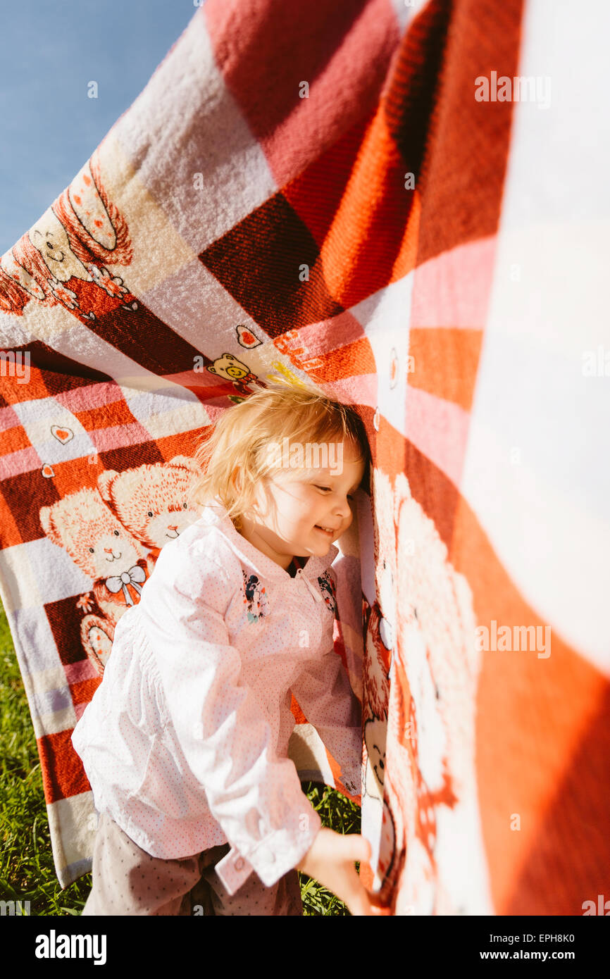 Little happy girl with blanket Stock Photo Alamy