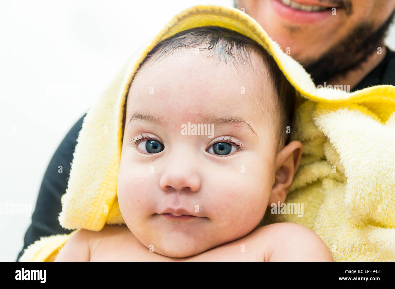 Cute baby boy with towel after bath Stock Photo Alamy