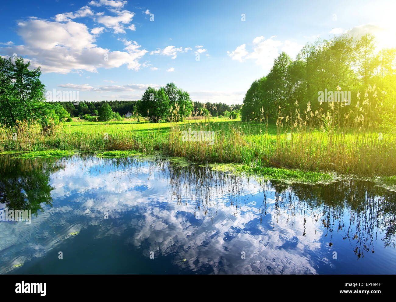 Reflexion of clouds in the spring river Stock Photo