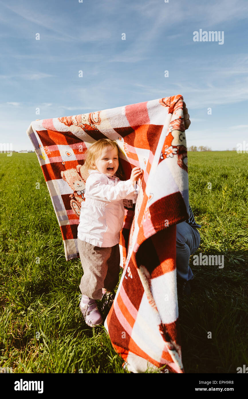 Little happy girl with blanket Stock Photo Alamy