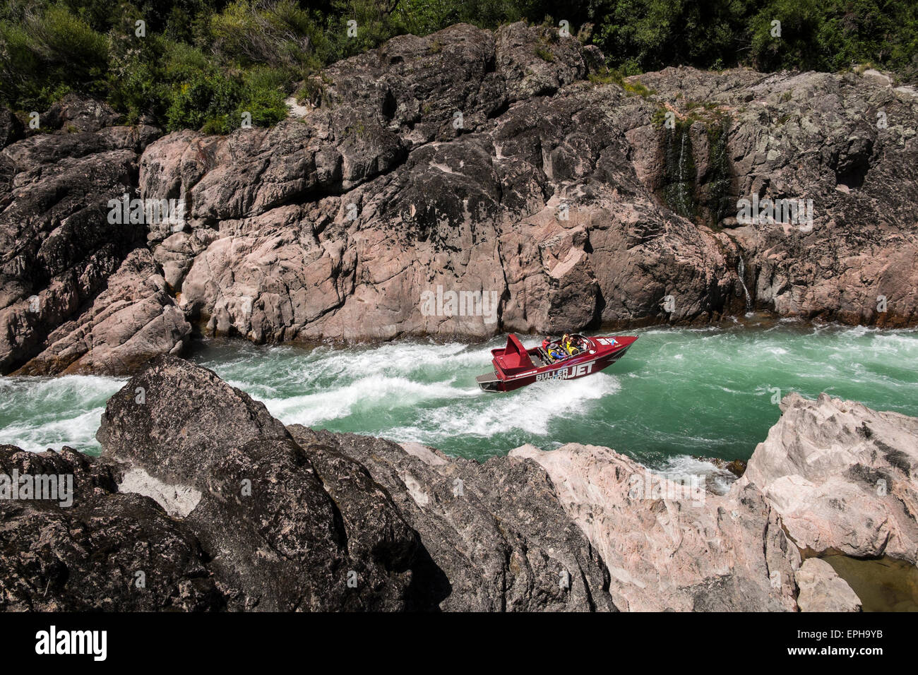 Buller Canyon Jet boat with tourists on a thrilling ride through a rocky ravine on the river, Murchison, New Zealand. Stock Photo