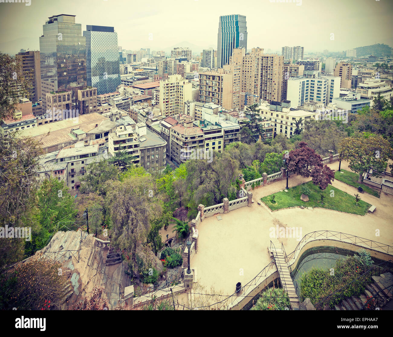 Retro stylized photo of Santiago de Chile downtown, modern skyscrapers mixed with historic buildings, Chile. Stock Photo