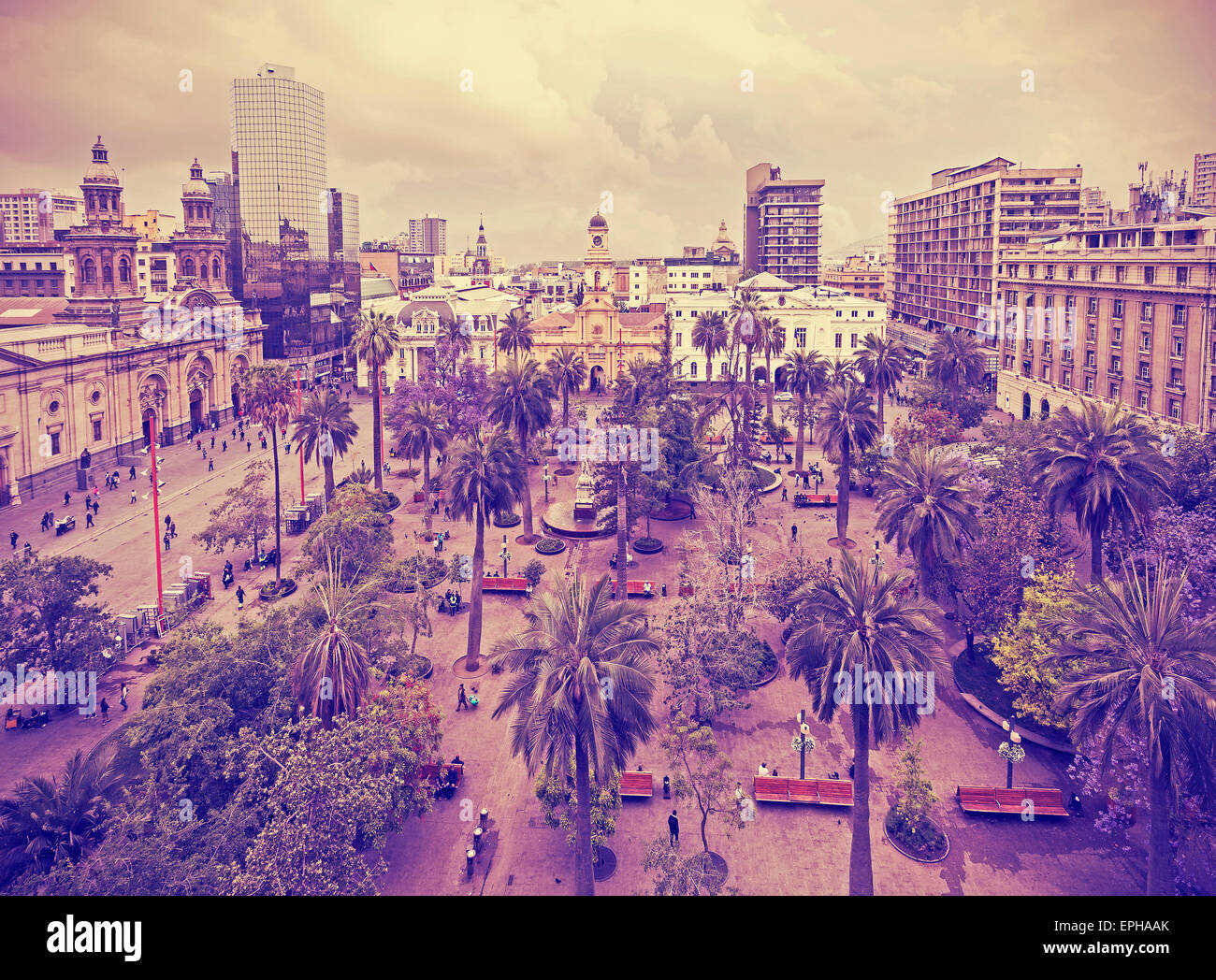 Vintage stylized photo of Santiago de Chile downtown, Plaza de Armas where modern skyscrapers mix with historic buildings, Chile Stock Photo