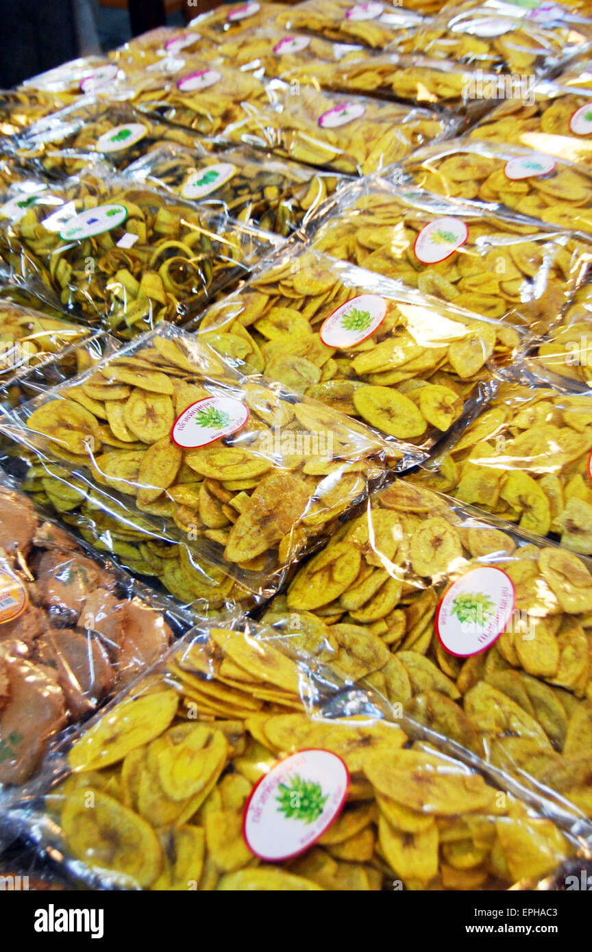 Packets of dried banana chips at a truckstop in Thailand Stock Photo