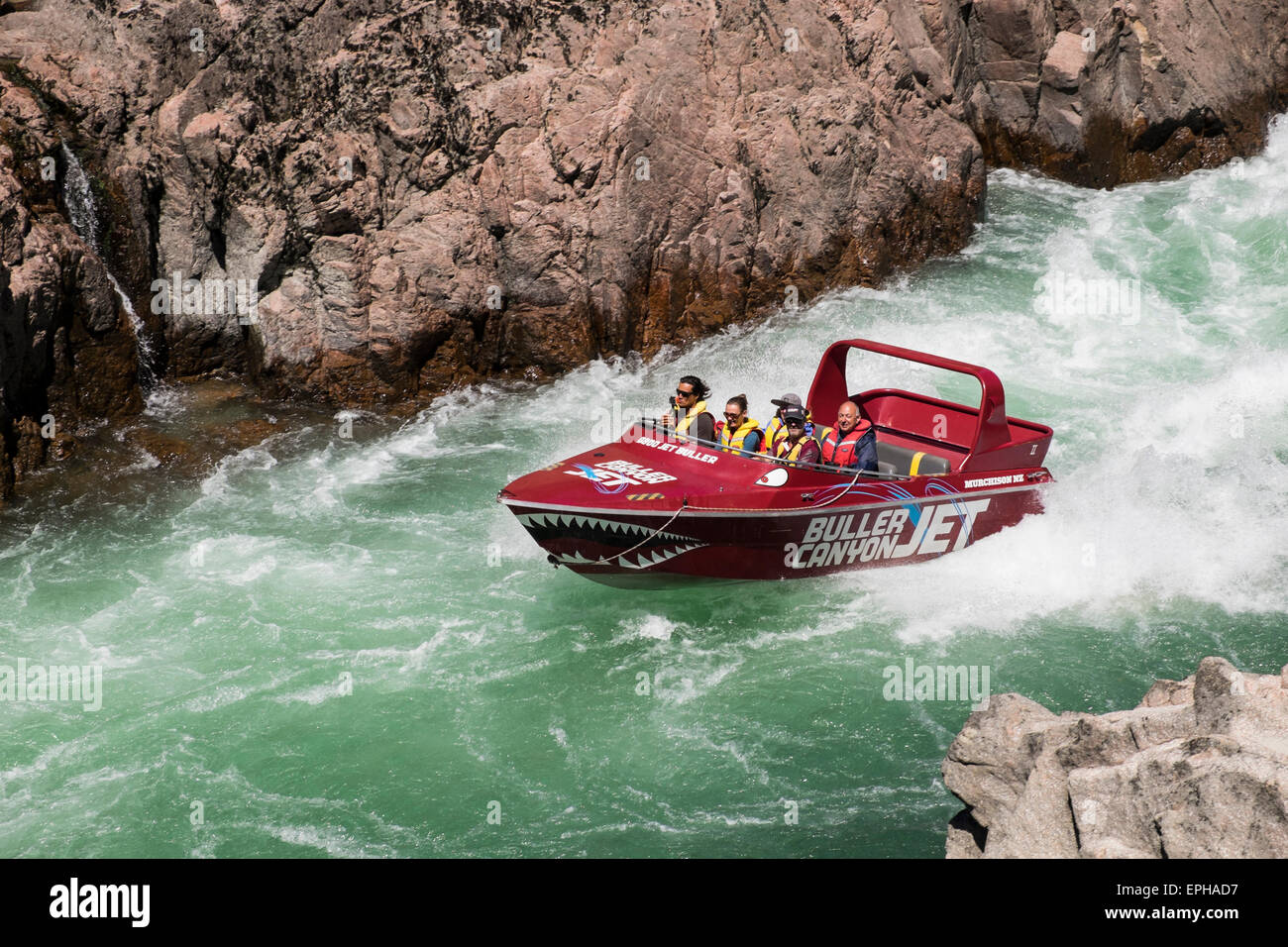 Buller Canyon Jet boat with tourists on a thrilling ride through a rocky ravine on the river, Murchison, New Zealand. Stock Photo