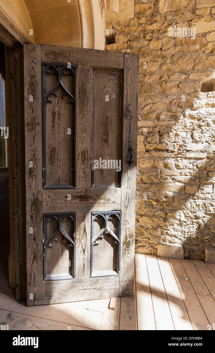 A wooden and wrought iron doorway at Woodchester mansion, Gloucestershire, England Stock Photo
