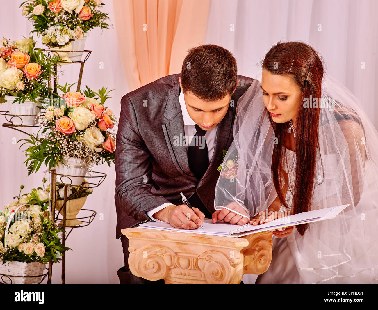 Groom and bride register marriage Stock Photo Alamy