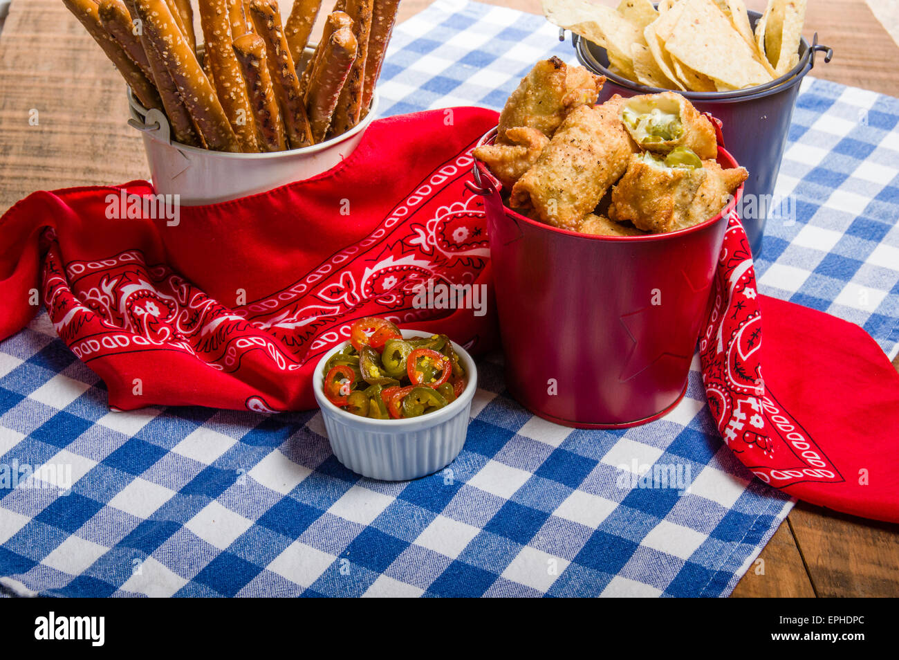 Jalapeno peppers and fried snacks with chips Stock Photo