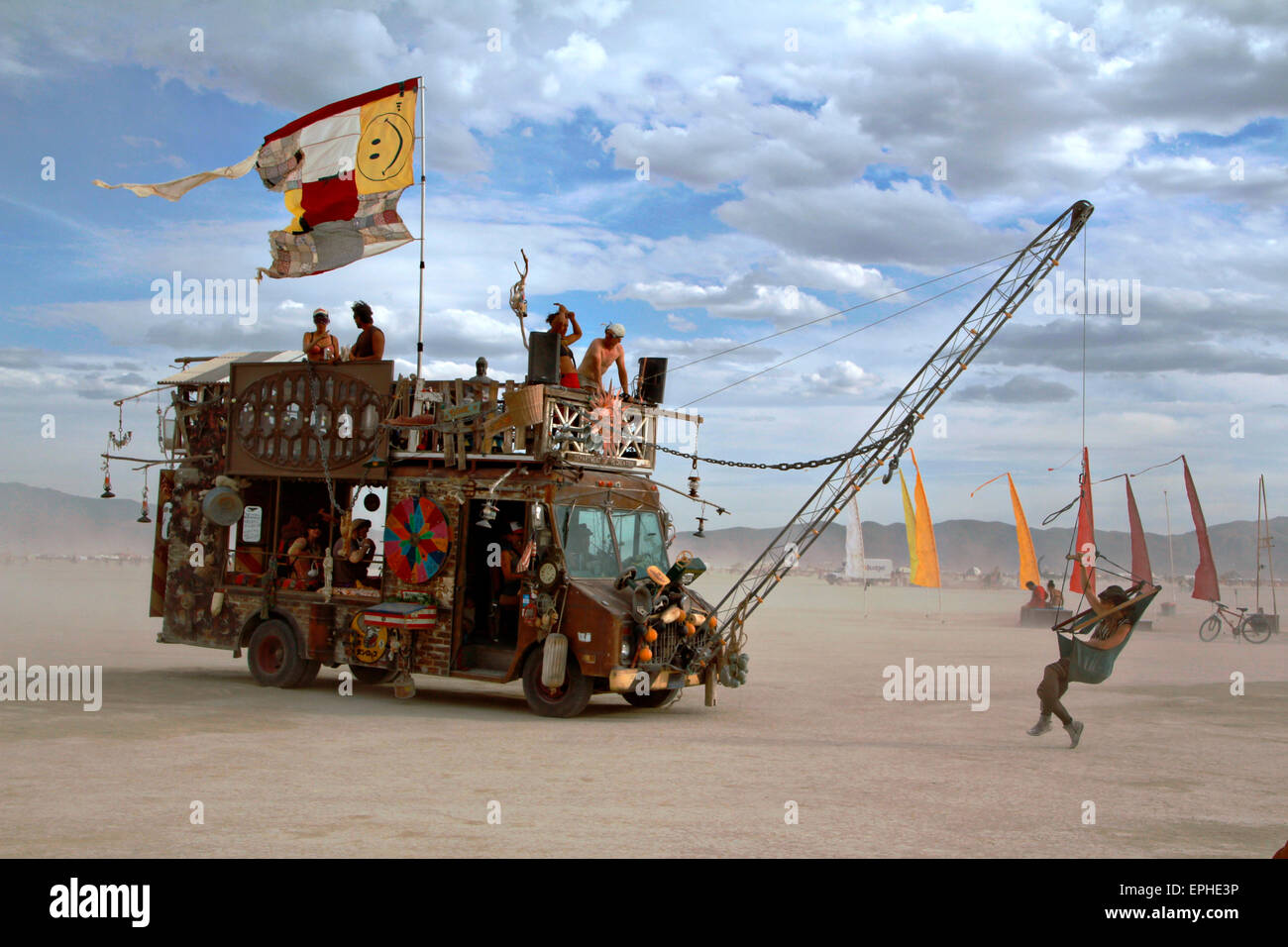 An art installation vehicle drives through the desert during the annual Burning Man festival in the desert August 30, 2014 in Black Rock City, Nevada. Stock Photo