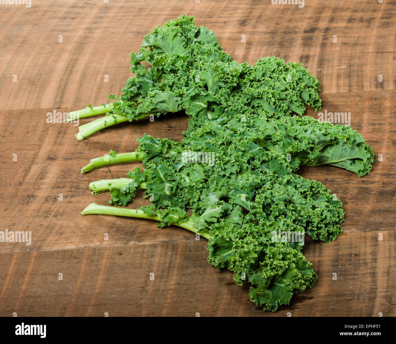Group of fresh curly kale leaves displayed Stock Photo Alamy