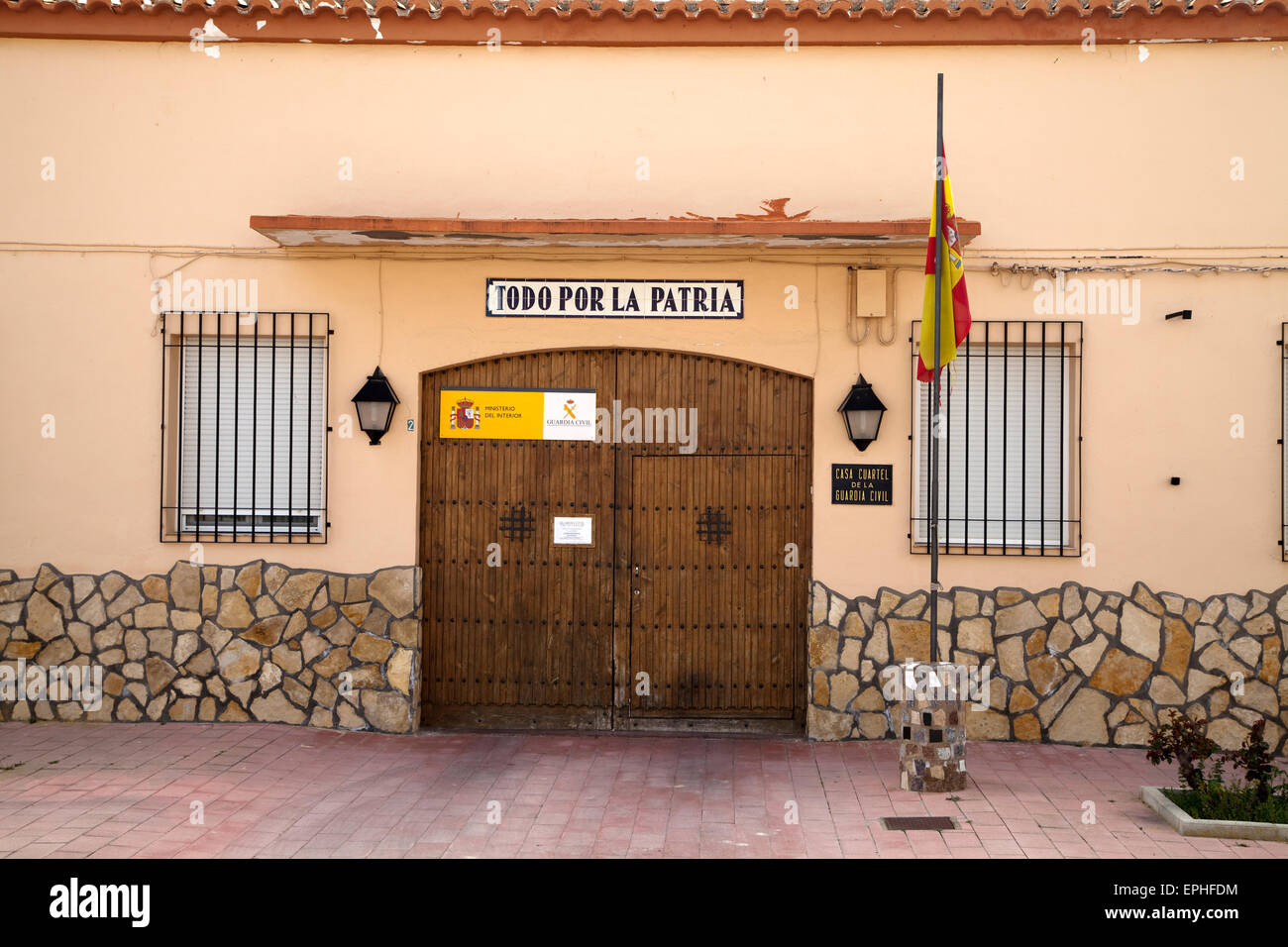 Guardia Civil station in Spain with the motto 'Todo por la Patria' (Everything for the country) above the door. Stock Photo