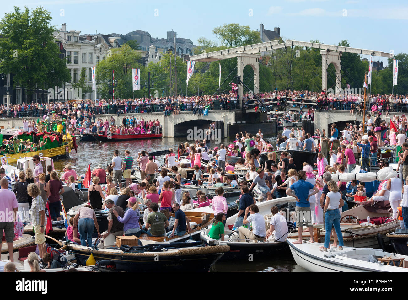 Amsterdam Gay Pride Canal Parade at the Magere Brug or Skinny Bridge on the Amstel River Stock Photo