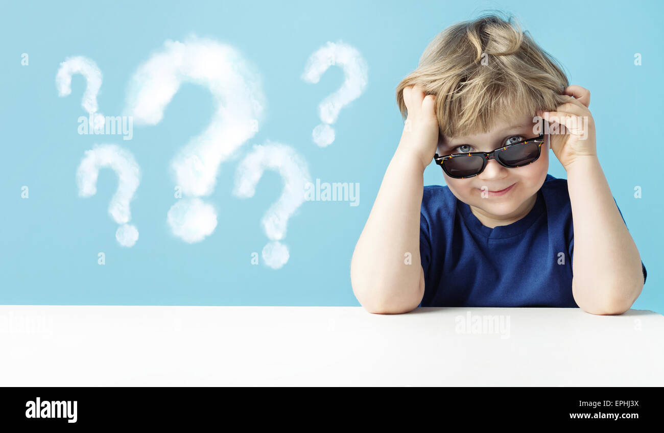 Cute little boy with questions Stock Photo