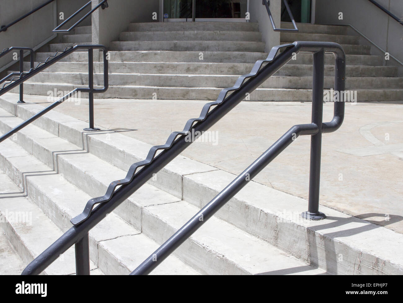 Anti-skateboard guard rail on steps Stock Photo