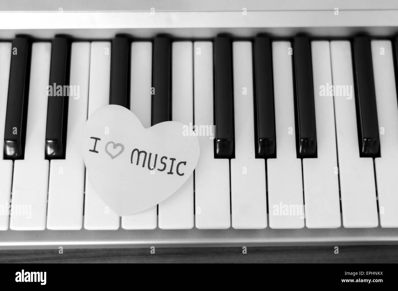paper heart on piano keyboard black and white color Stock Photo Alamy