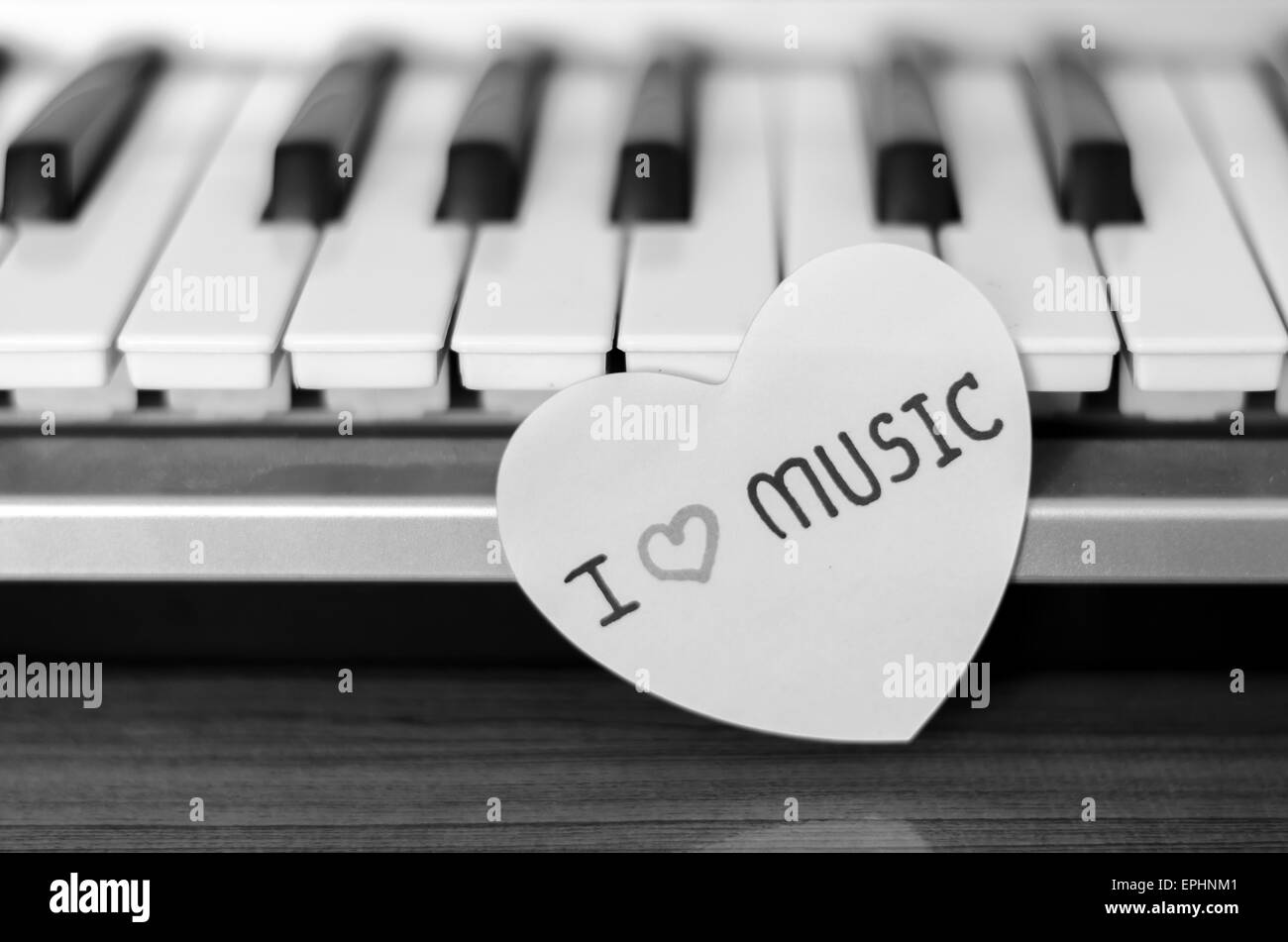 paper heart on piano keyboard black and white color Stock Photo Alamy