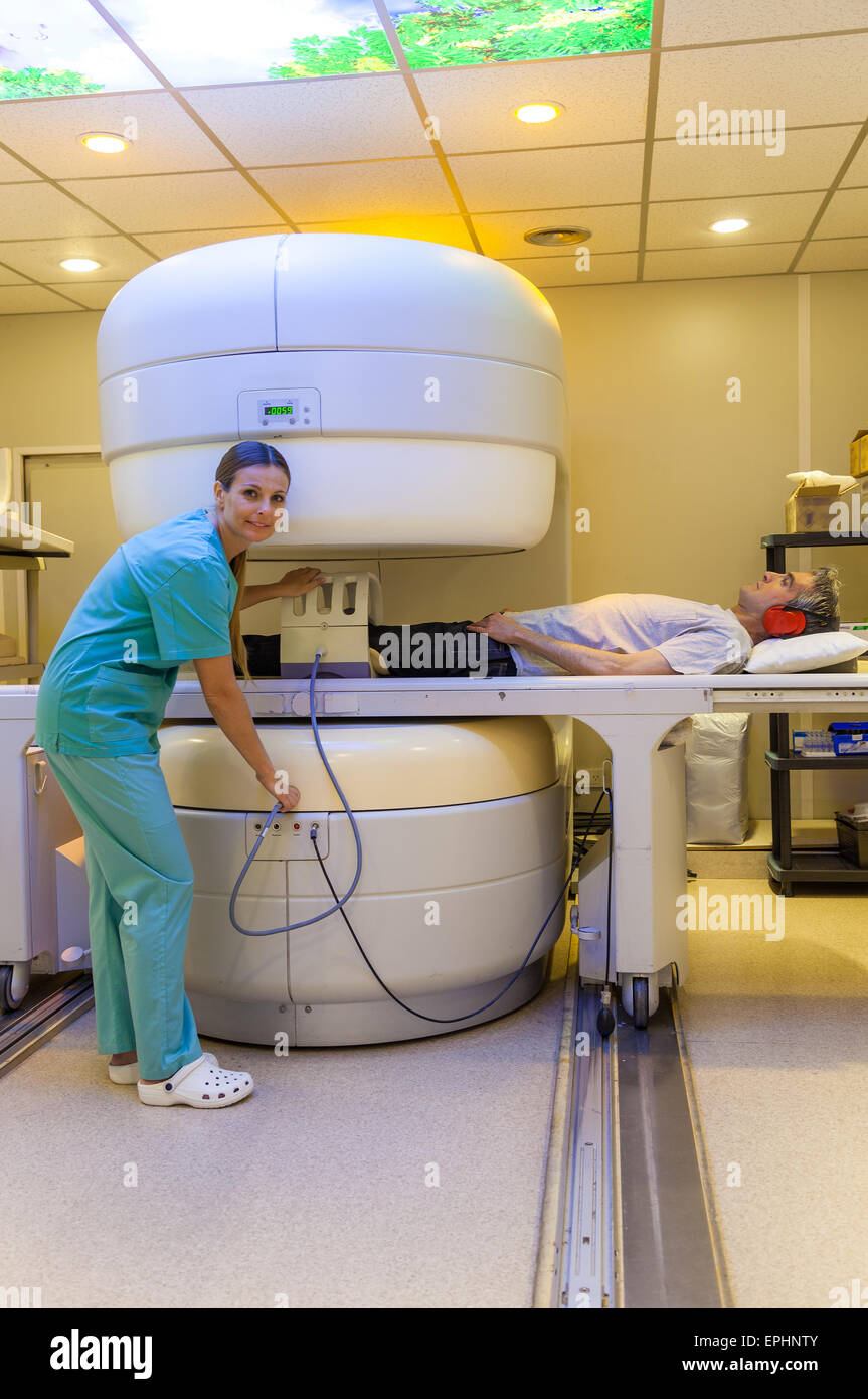 Female doctor checking mri machine with male patient Stock Photo Alamy
