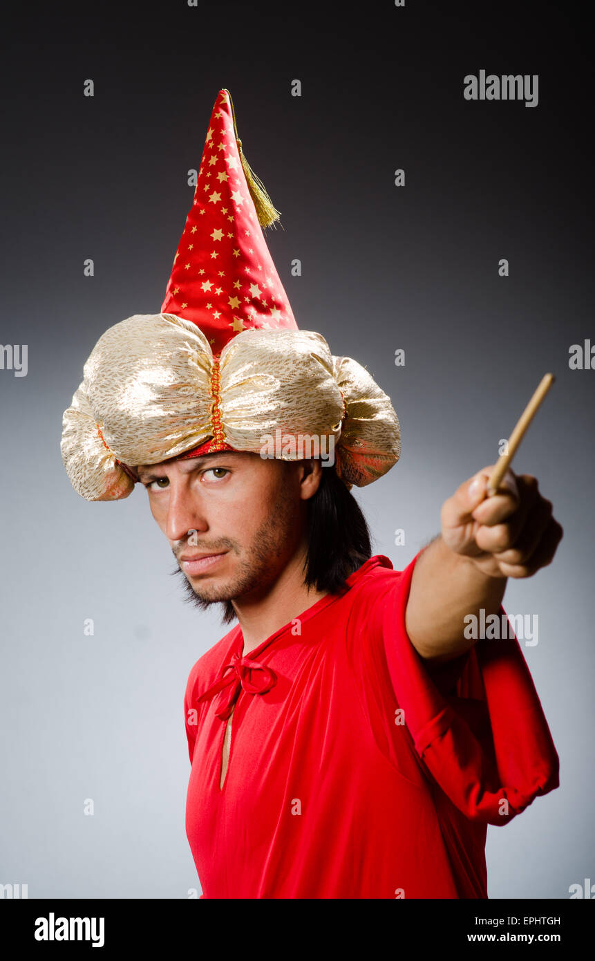 Funny wizard wearing red dress Stock Photo - Alamy