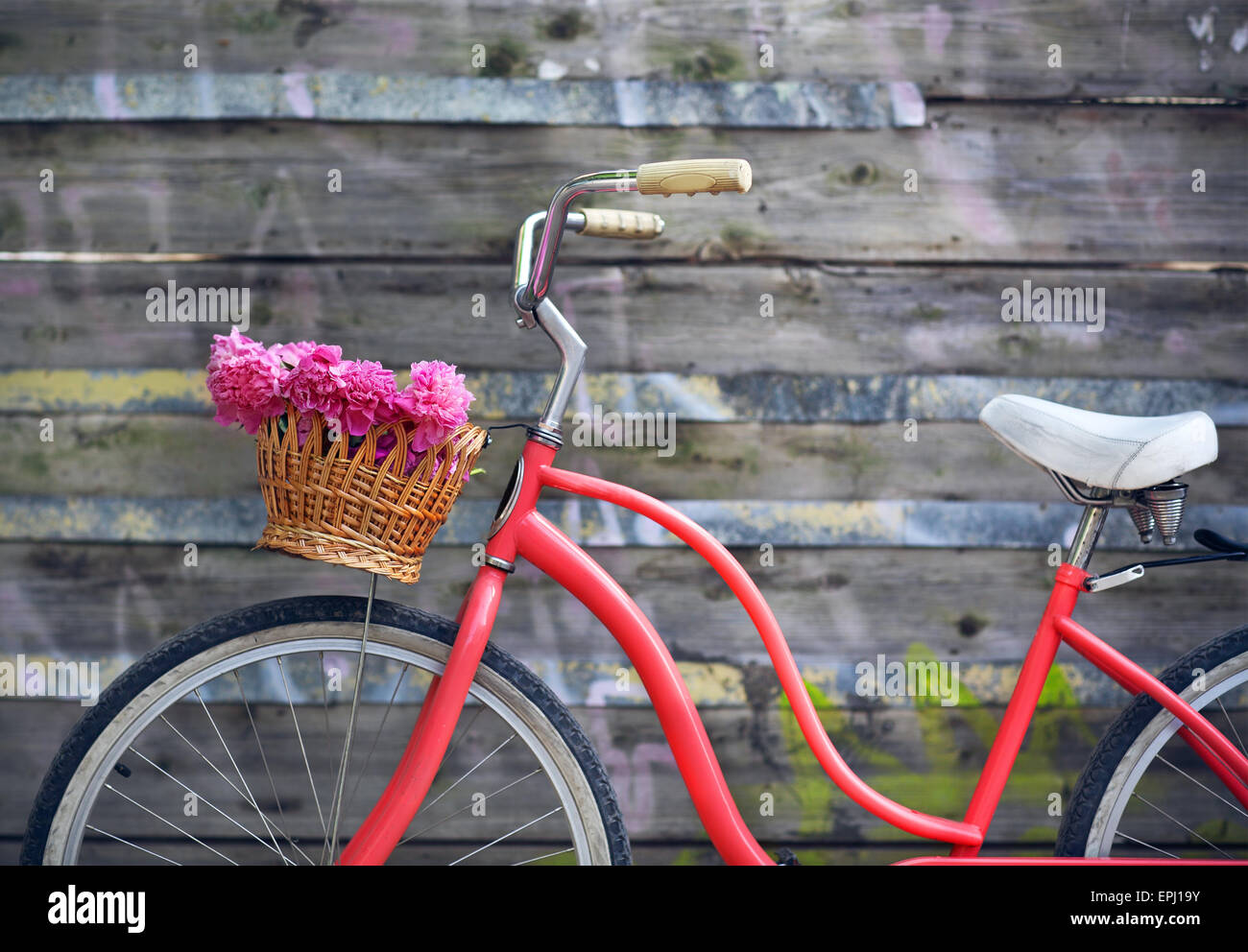 Vintage bicycle with basket with peony flowers Stock Photo Alamy