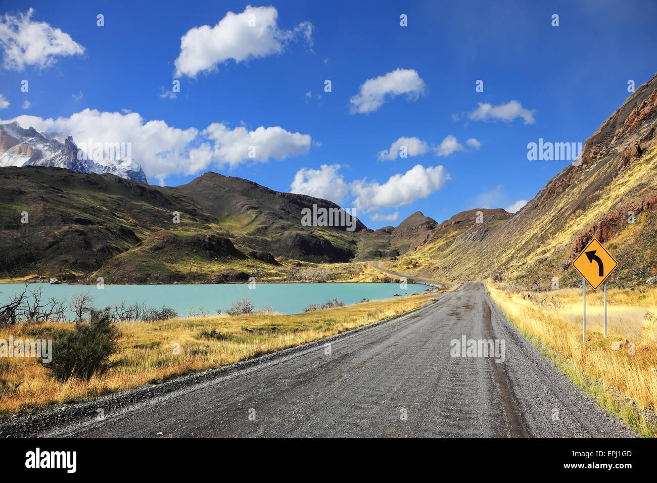 The dirt road along the shore of lake Stock Photo