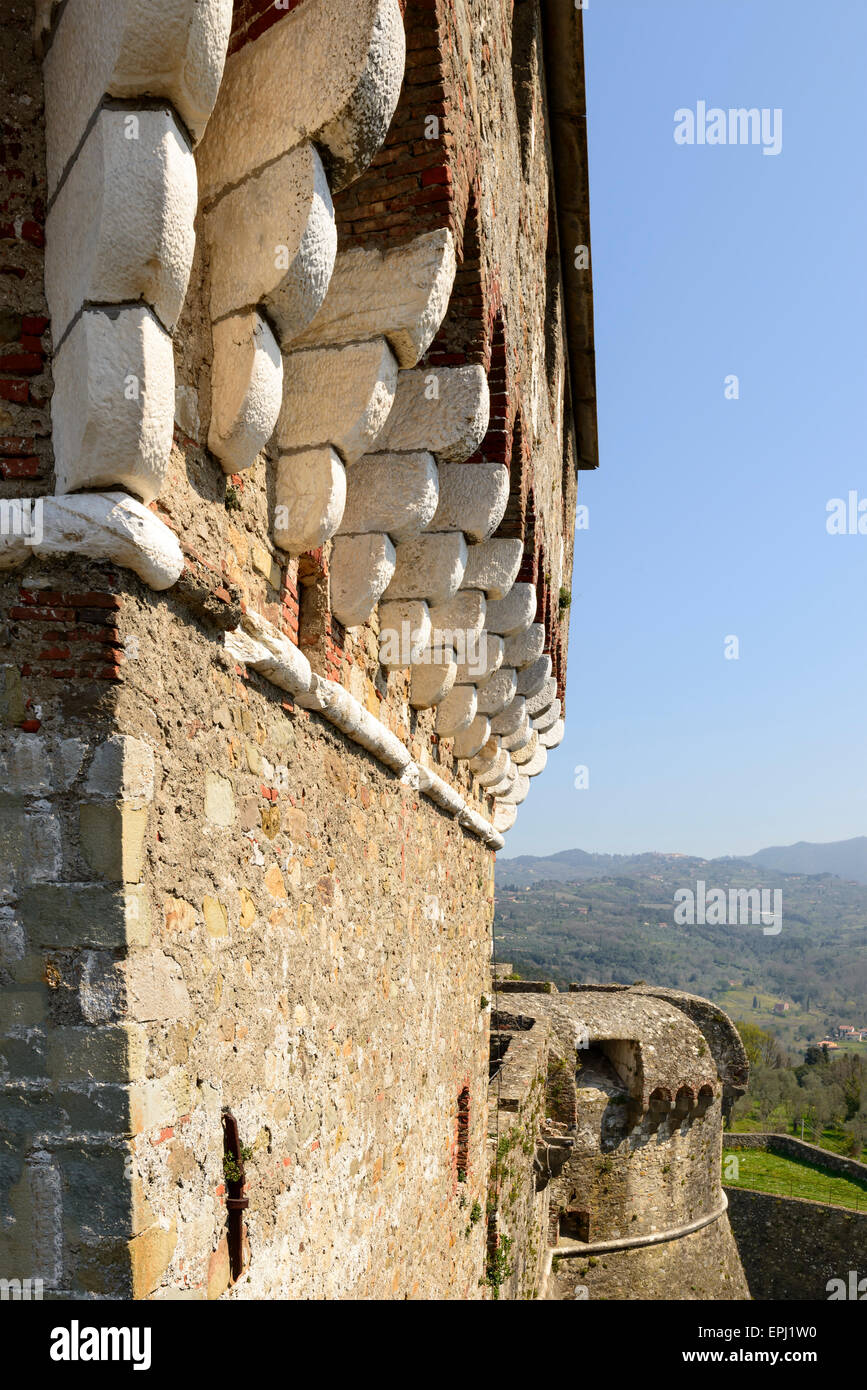 detail of high tower corbels on the ramparts at ancient Castle , shot on a  sunny spring day with the hilly inland in background Stock Photo - Alamy