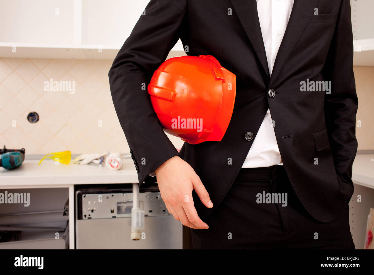 businessman holding red helmet Stock Photo