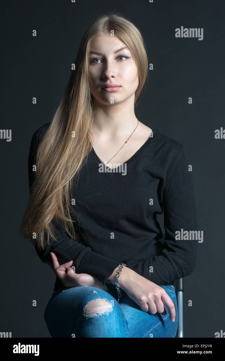 Spiritual and mental studio portrait of the Russian beautiful teenage girl with light long hair Stock Photo