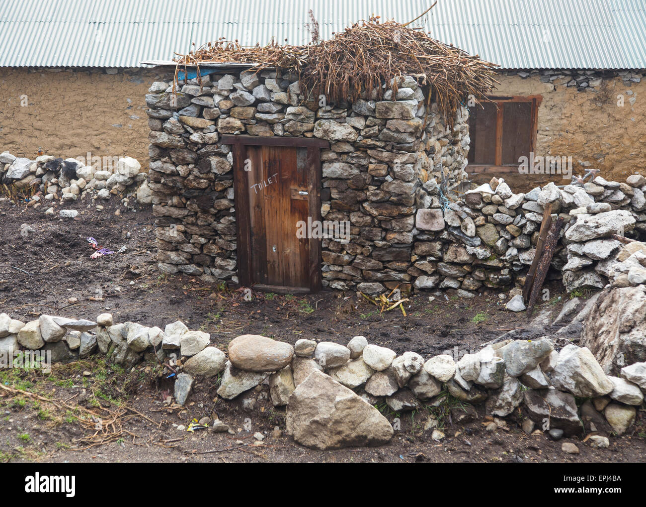 A stone built traditional earth closet toilet, Everest Region Nepal Stock Photo