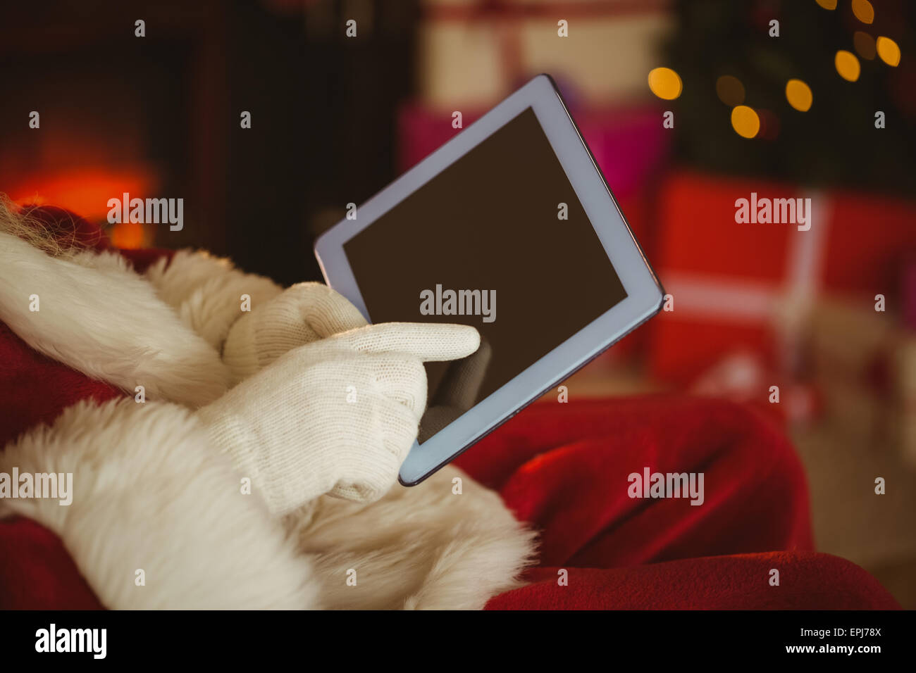 Santa claus touching tablet pc Stock Photo - Alamy
