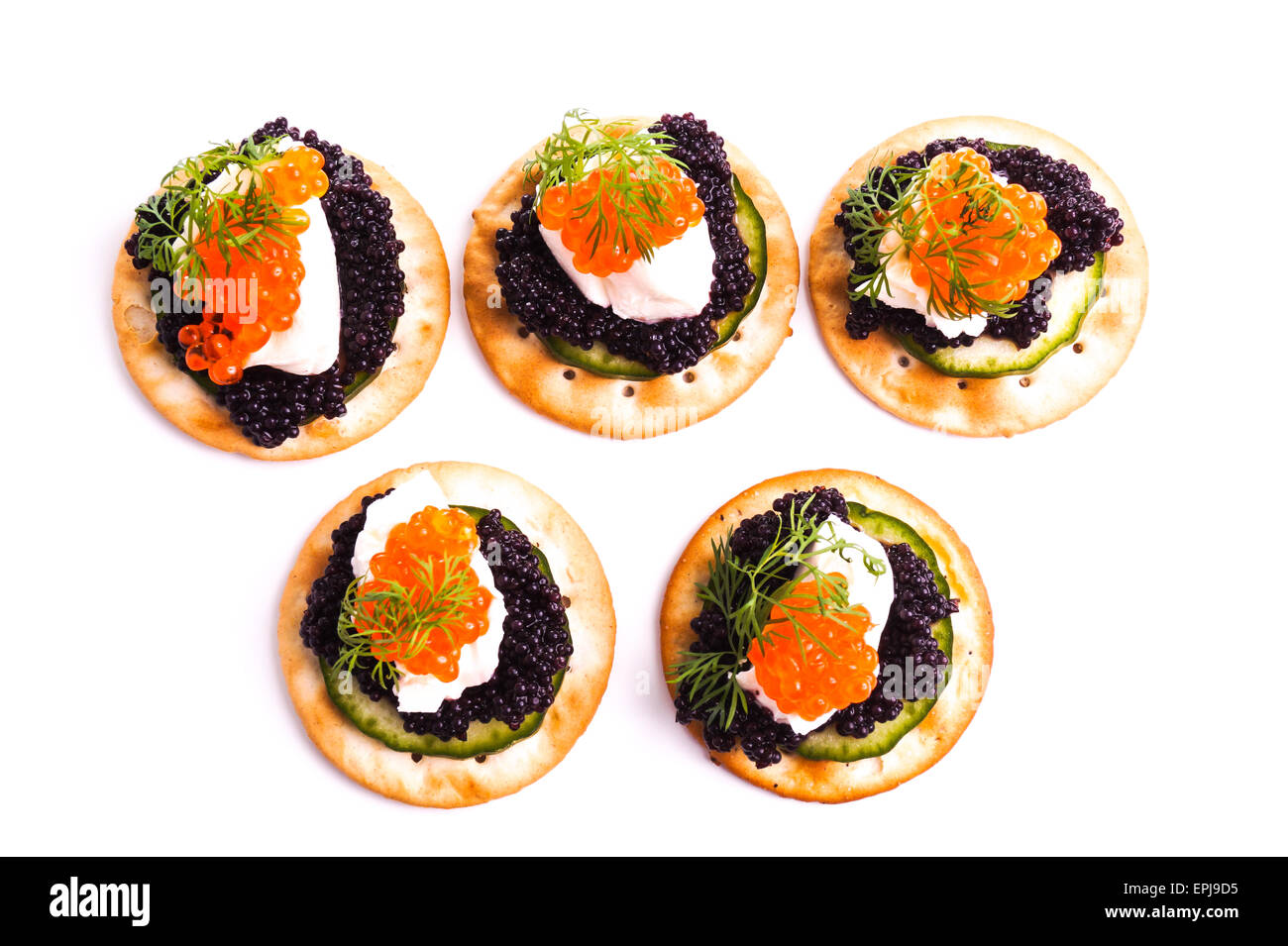 Caviar Appetizer served on crackers isolated on white Stock Photo Alamy