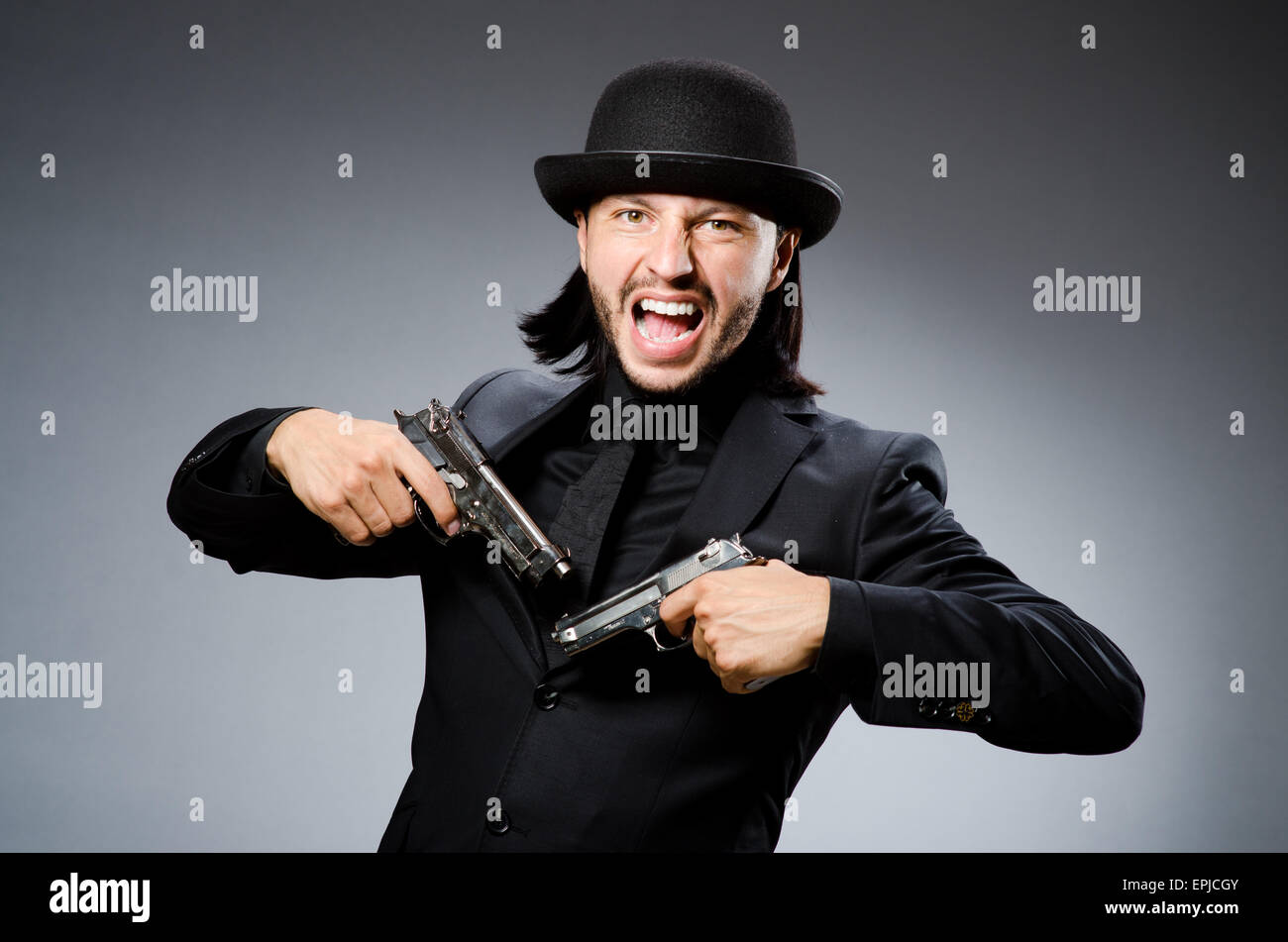Man wearing vintage hat with gun Stock Photo Alamy