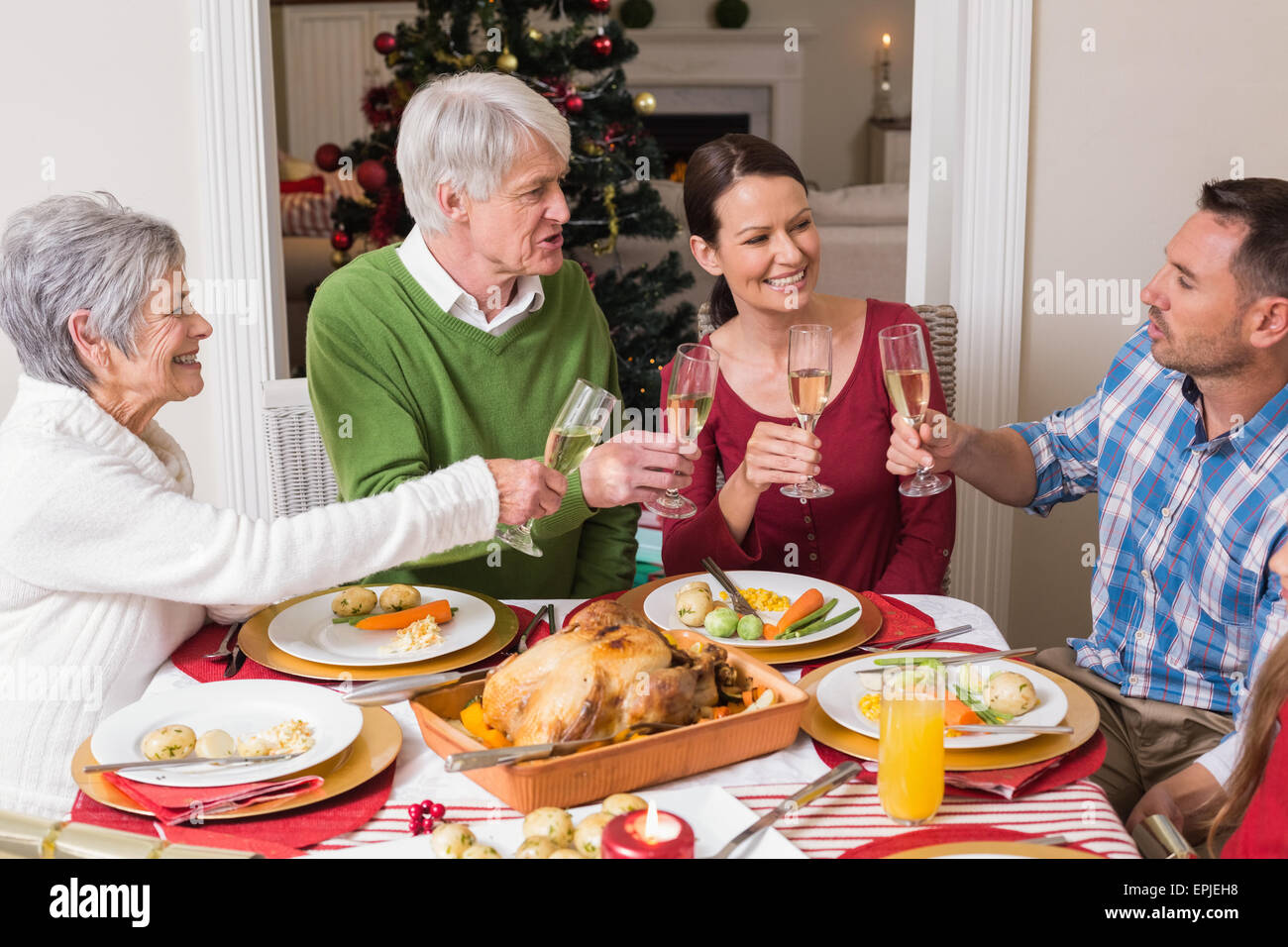 Portrait of happy family toasting at christmas dinner Stock Photo