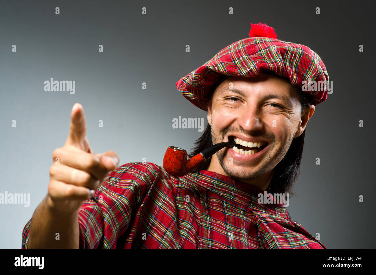 Funny scotsman with smoking pipe Stock Photo Alamy