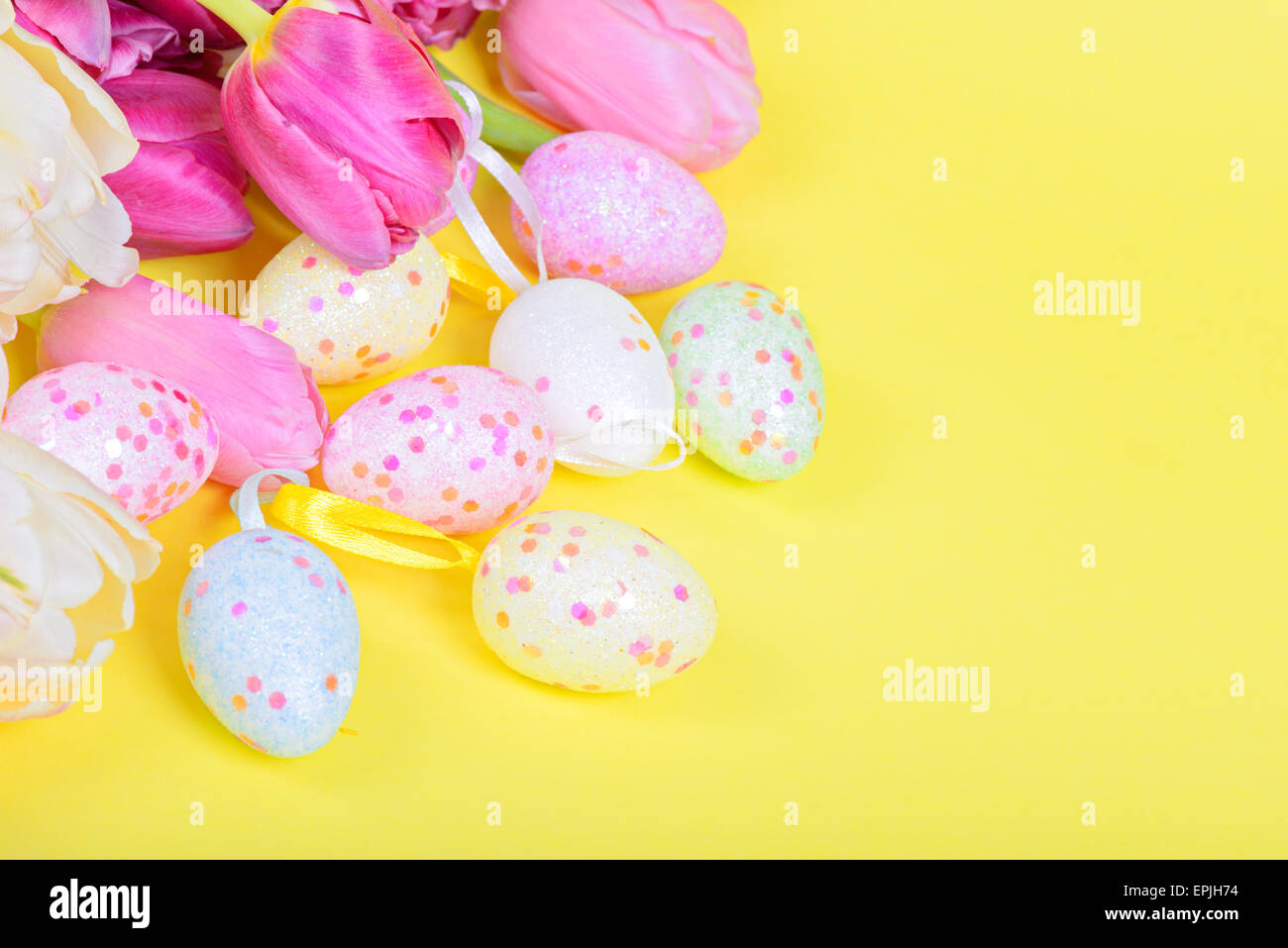 Easter eggs and pink tulips Stock Photo - Alamy
