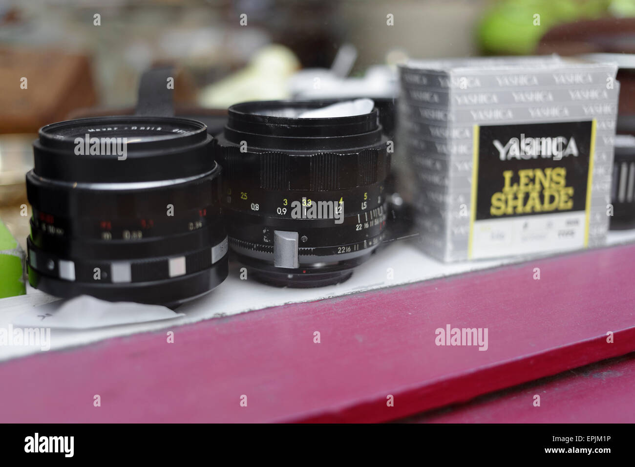 Second hand camera lenses on display in a shop window Stock Photo Alamy