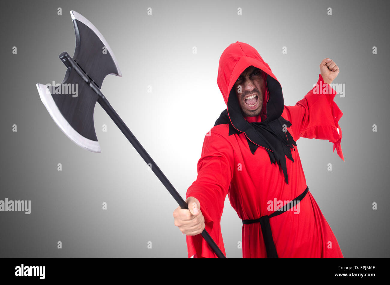Executioner in red costume with axe on white Stock Photo