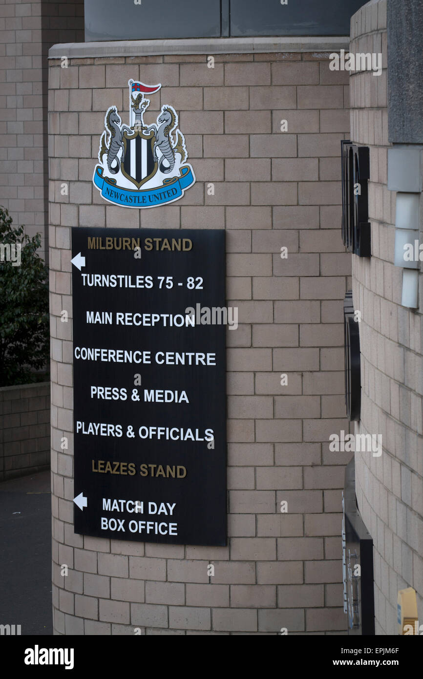The club crest and information sign on the exterior of the Milburn Stand of the stadium before Newcastle United host Tottenham Hotspurs in an English Premier League match at St. James' Park. The match was boycotted by a section of the home support critical of the role of owner Mike Ashley and sponsorship by a payday loan company. The match was won by Spurs by 3-1, watched by 47,427, the lowest league gate of the season at the stadium. Stock Photo