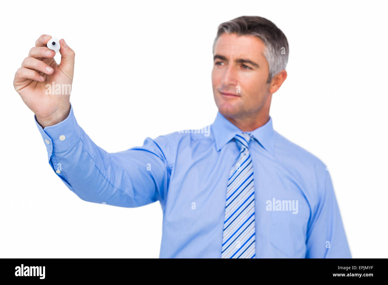 Concentrated businessman writing with marker Stock Photo - Alamy