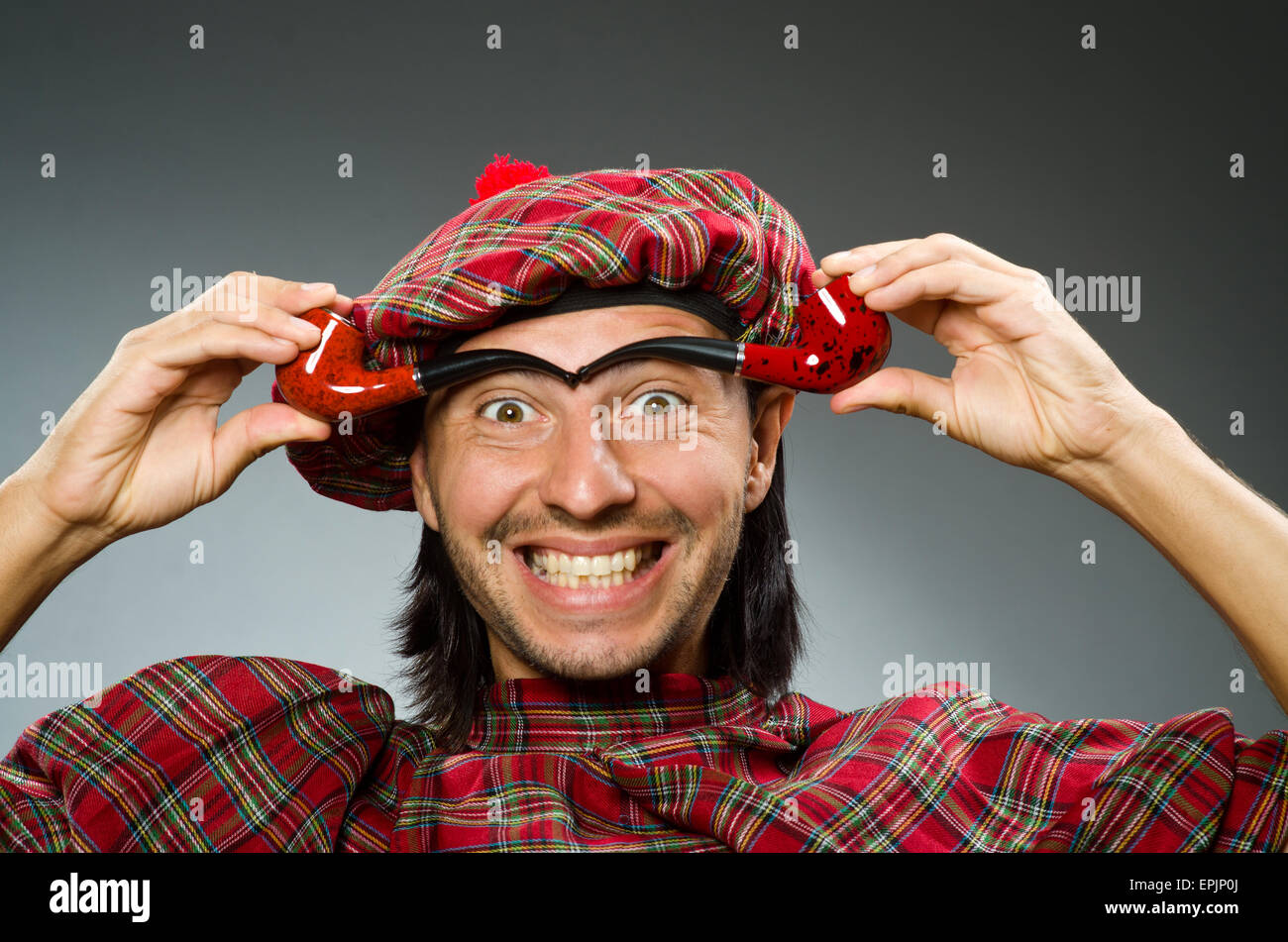 Funny scotsman with smoking pipe Stock Photo Alamy