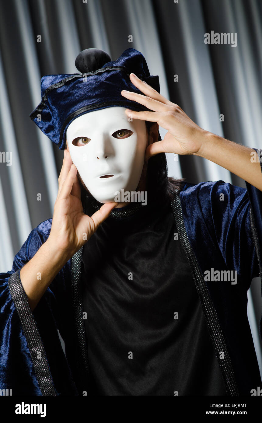 Funny concept with theatrical mask Stock Photo