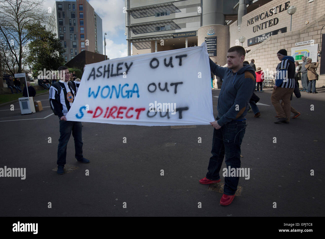 Supporters showing off a protest banner at the Gallowgate end of the stadium before Newcastle United host Tottenham Hotspurs in an English Premier League match at St. James' Park. The match was boycotted by a section of the home support critical of the role of owner Mike Ashley and sponsorship by a payday loan company. The match was won by Spurs by 3-1, watched by 47,427, the lowest league gate of the season at the stadium. Stock Photo