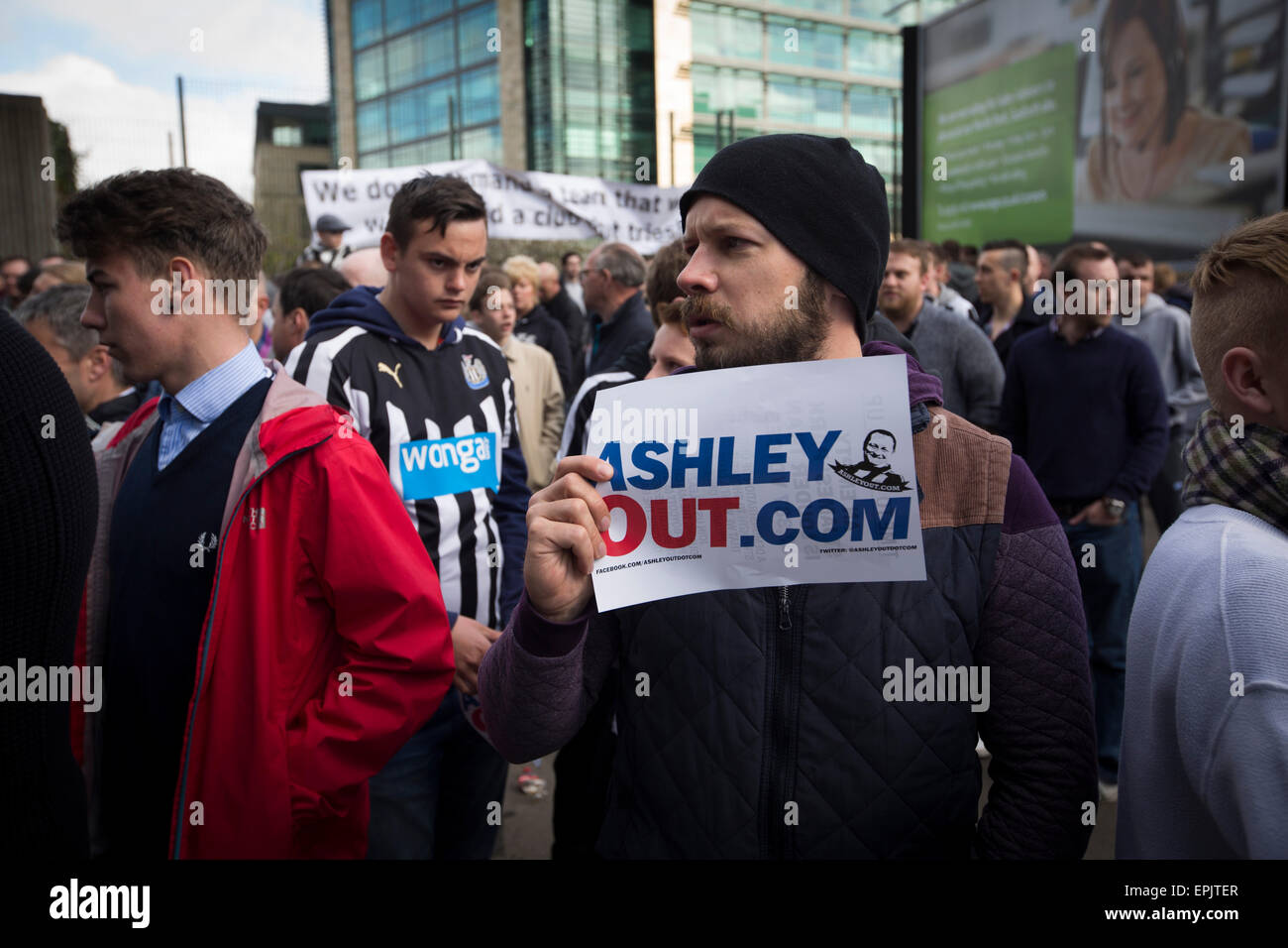 A protester holding a sign during a demonstration at the Gallowgate end of the stadium before Newcastle United host Tottenham Hotspurs in an English Premier League match at St. James' Park. The match was boycotted by a section of the home support critical of the role of owner Mike Ashley and sponsorship by a payday loan company. The match was won by Spurs by 3-1, watched by 47,427, the lowest league gate of the season at the stadium. Stock Photo
