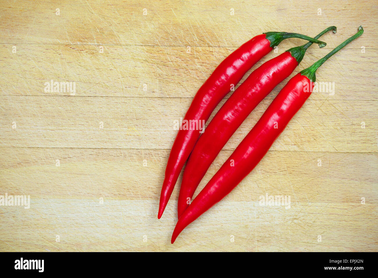 peppers on the wooden background Stock Photo - Alamy