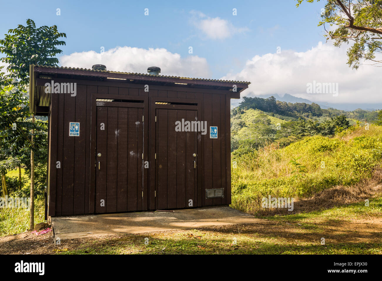 Wooden restroom in forest Stock Photo