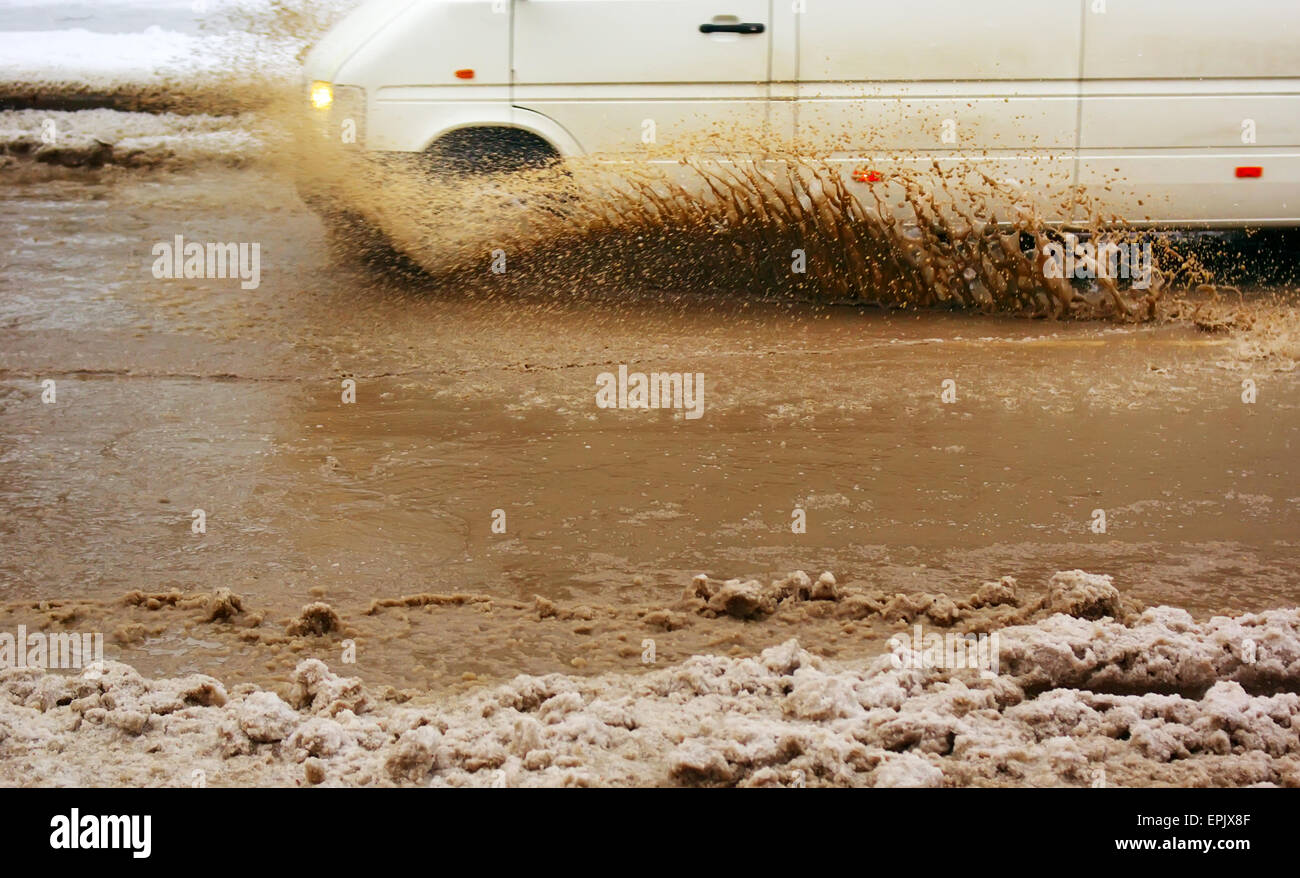 Car splash the puddle. Dynamic scene Stock Photo Alamy