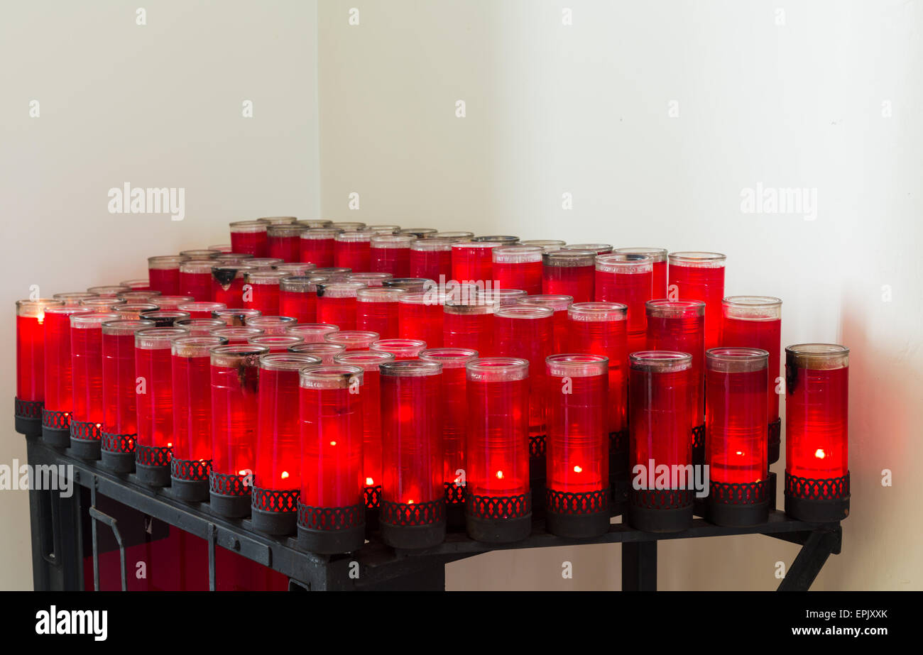Rows of red votive candles in Catholic church Stock Photo Alamy